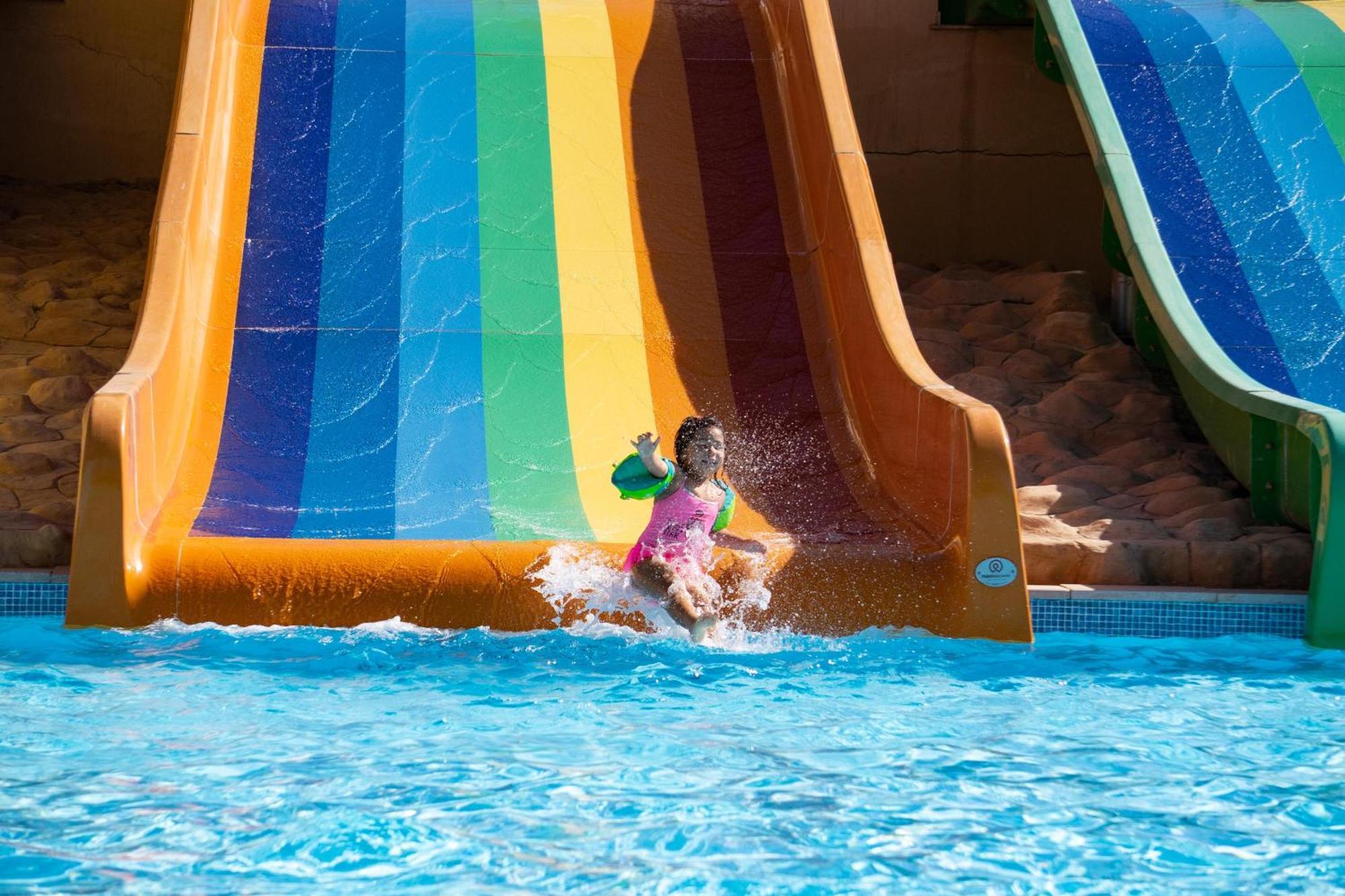 Fanar Hotel & Residences Salalah Exterior foto A child on a water slide